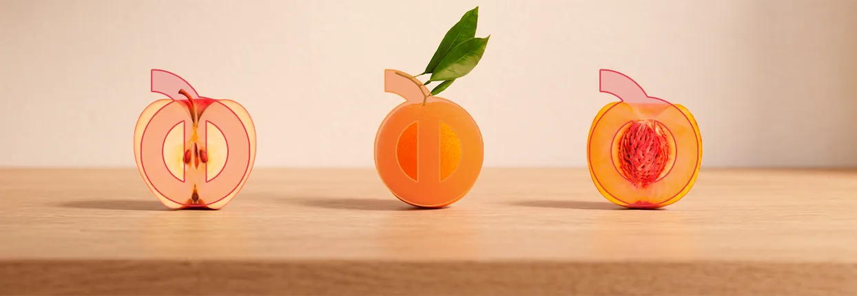 O isotipo Noboru aplicado sobre maçã, laranja e pêssego cortados